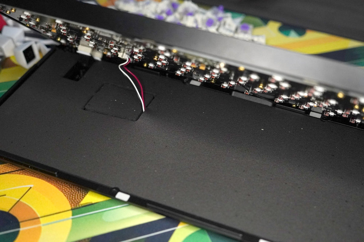 The battery cable still connects the two halves
