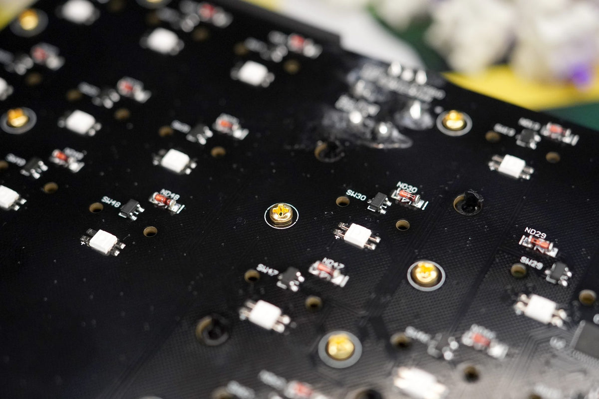 The plate screws on the back of the PCB