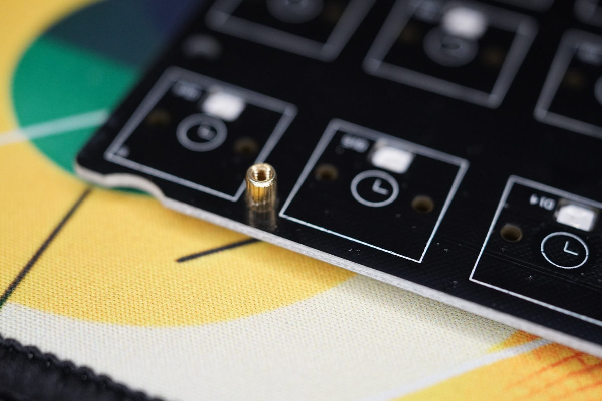 A standoff on the switch side of the PCB